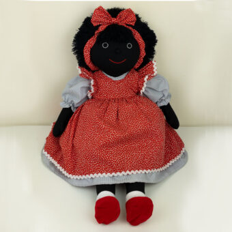 Handmade cloth doll in a red pini and stripe dress